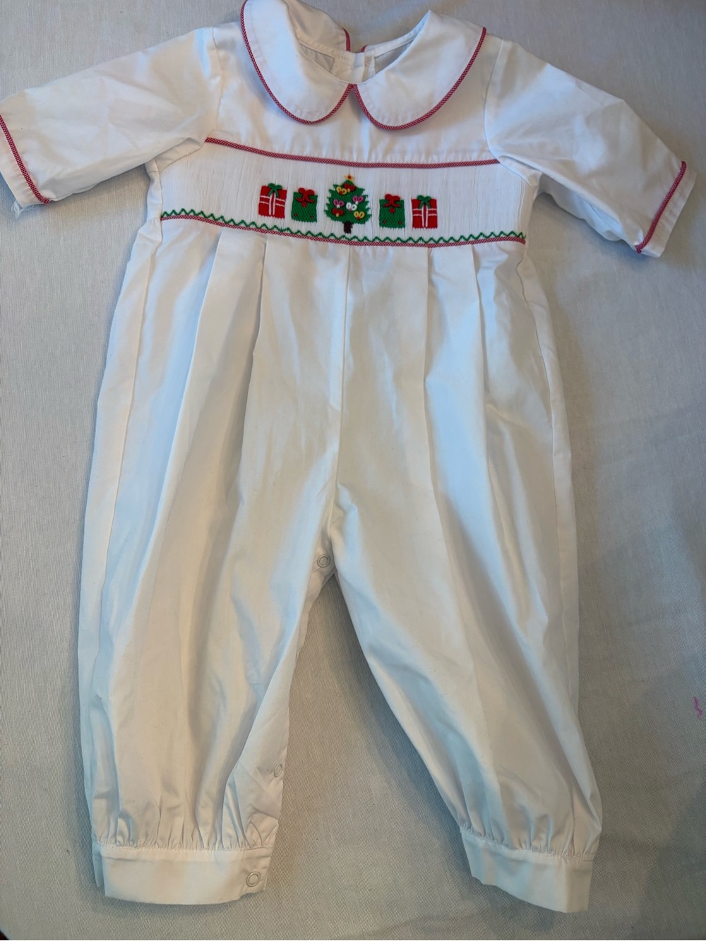White Smocked Holiday Romper with Red Trim